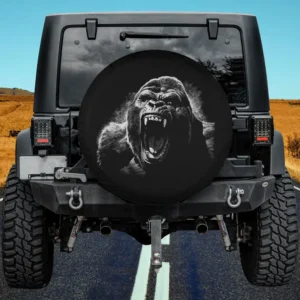 Angry growling face silverback gorilla spare tire cover on Jeep with fierce monochrome art