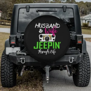 Husband and Wife Jeepin Through Life spare tire cover with camera hole variant