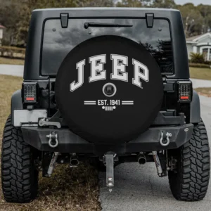 Jeep Collegiate white print spare tire cover with camera hole installed on Jeep