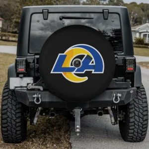 Los Angeles Rams blue and yellow NFL spare tire cover on Jeep with camera hole