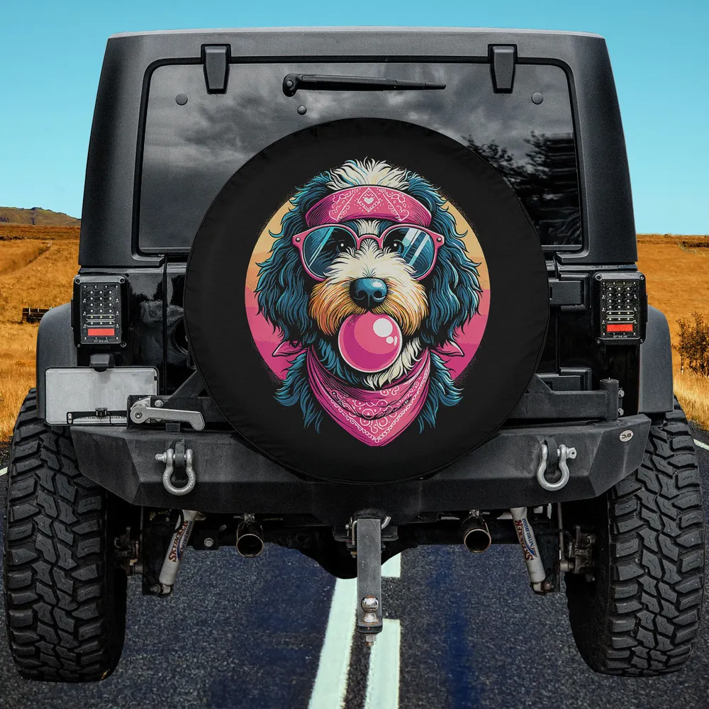 Bernedoodle dog with pink bandana, sunglasses, and bubble gum art spare tire cover no camera hole