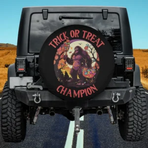 Bigfoot holding pumpkin candy bucket in spooky forest Halloween spare tire cover