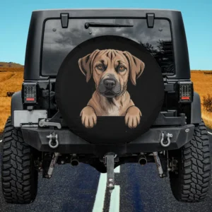 Black Mouth Cur peeking pocket puppy dog spare tire cover on Jeep with no camera hole