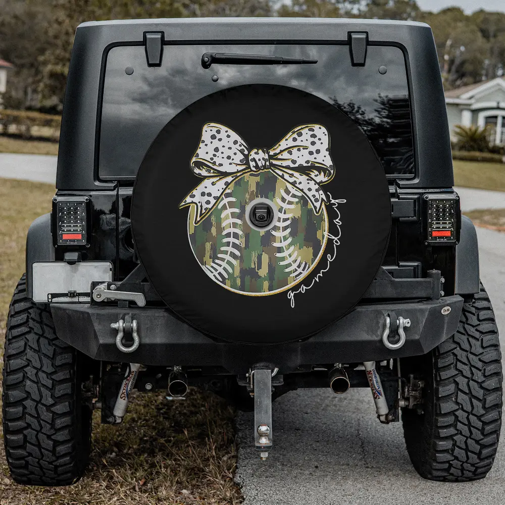Baseball game day spare tire cover with camouflage and polka dot bow for backup camera