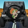 Cartoon Irish girl with orange curls and headscarf flexing arm on spare tire cover, no camera hole