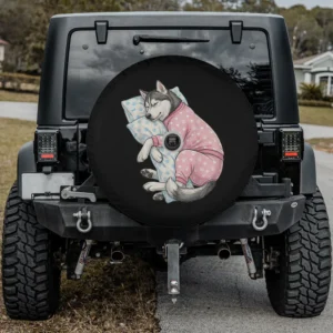 Cute Siberian Husky in pink pajamas sleeping on pillow spare tire cover with camera hole