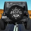 Distressed compass mountain axes Pacific Northwest spare tire cover without camera hole on RV