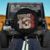 Distressed Friday the 13th blood logo spare tire cover on Jeep without camera hole