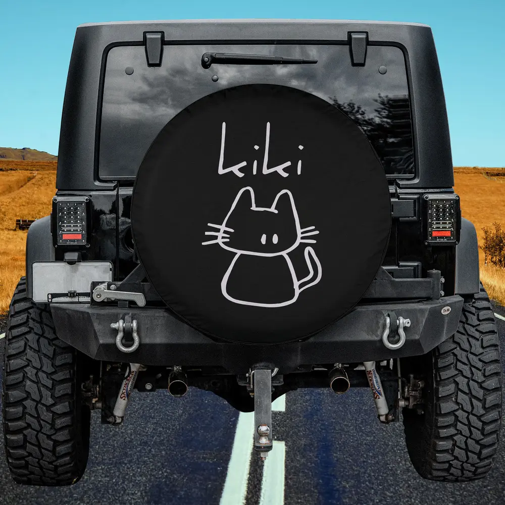 kiki hand-drawn cat custom name spare tire cover with bold white cartoon art, no camera hole