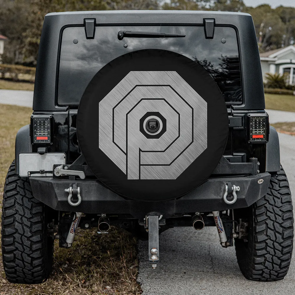 Brushed metal octagon OCP logo spare tire cover with camera hole for travel trailer