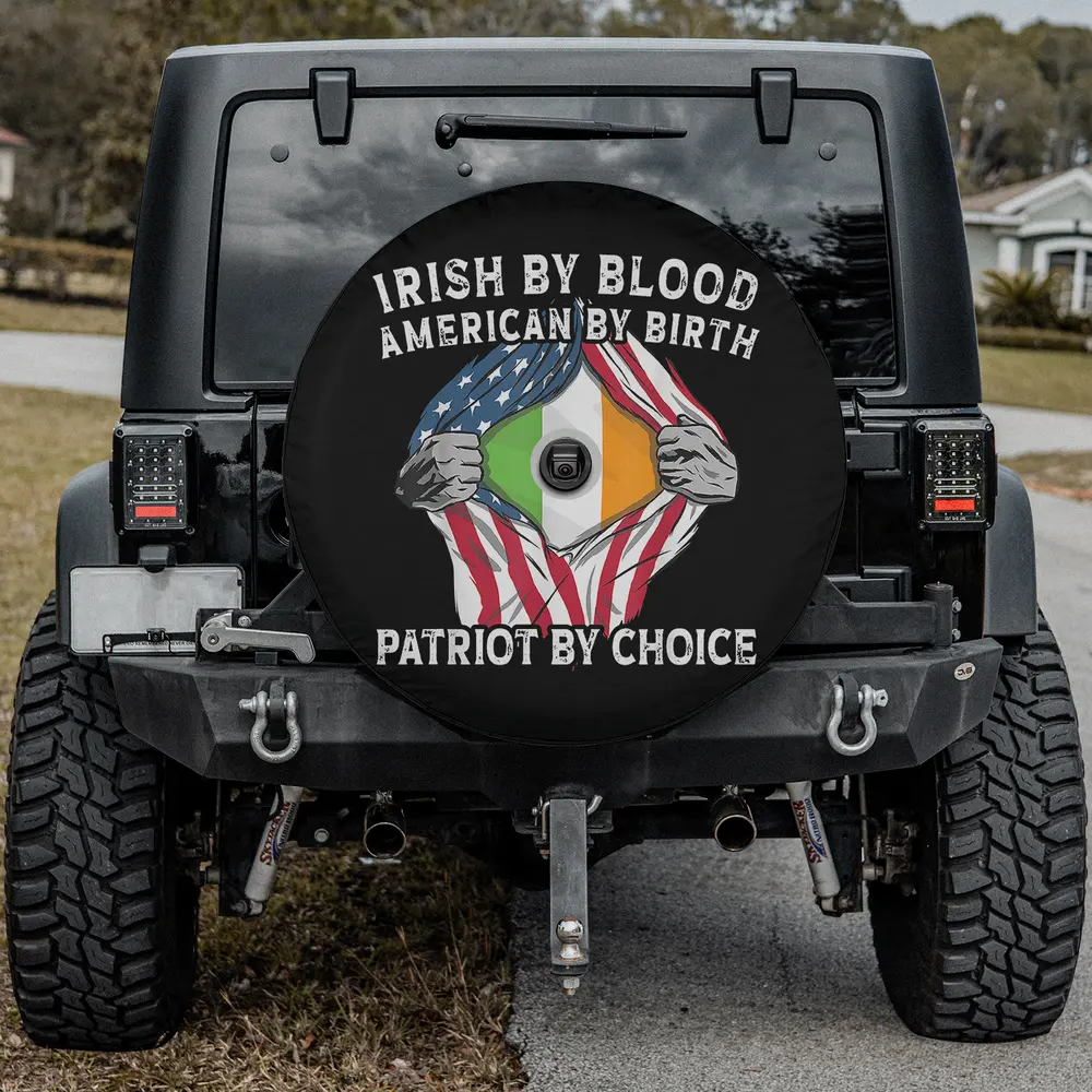 Ripped American flag hands Irish flag spare tire cover with backup camera hole