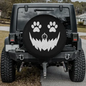 Halloween spare tire cover with scary pumpkin face and pet paw prints, backup camera hole option