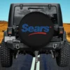 blue sears logo red swoosh maple leaf spare tire cover on Honda HRV