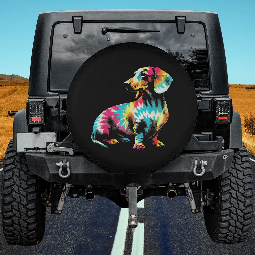 Tie dye zigzag dachshund dog spare tire cover on Jeep in field