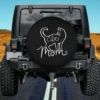 White line art cat with green eye and cat mom humor on spare tire cover no camera hole