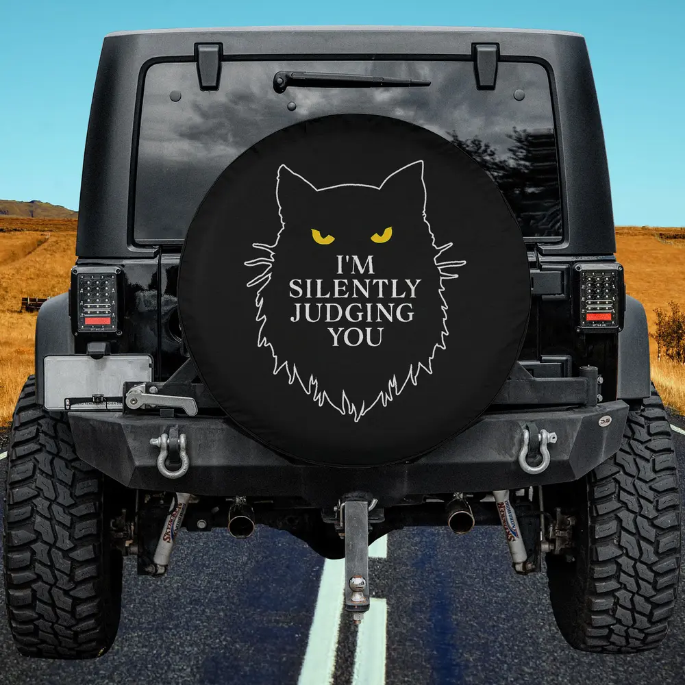 yellow eyes black cat silhouette silently judging spare tire cover no camera hole