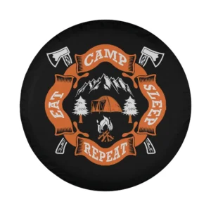 Bold camping spare tire cover design with axes, tent, campfire, and mountain scene