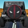 Deadpool Wolverine belt buckle face logo spare tire cover on Jeep with black and red comic design
