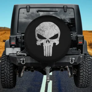 Distressed Punisher skull Marvel Comics spare tire cover on Jeep with no camera hole