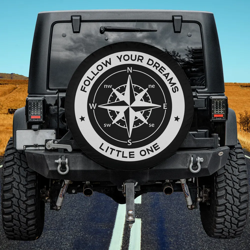 Follow Your Dreams compass camping spare tire cover with bold compass rose and inspirational text, no camera hole