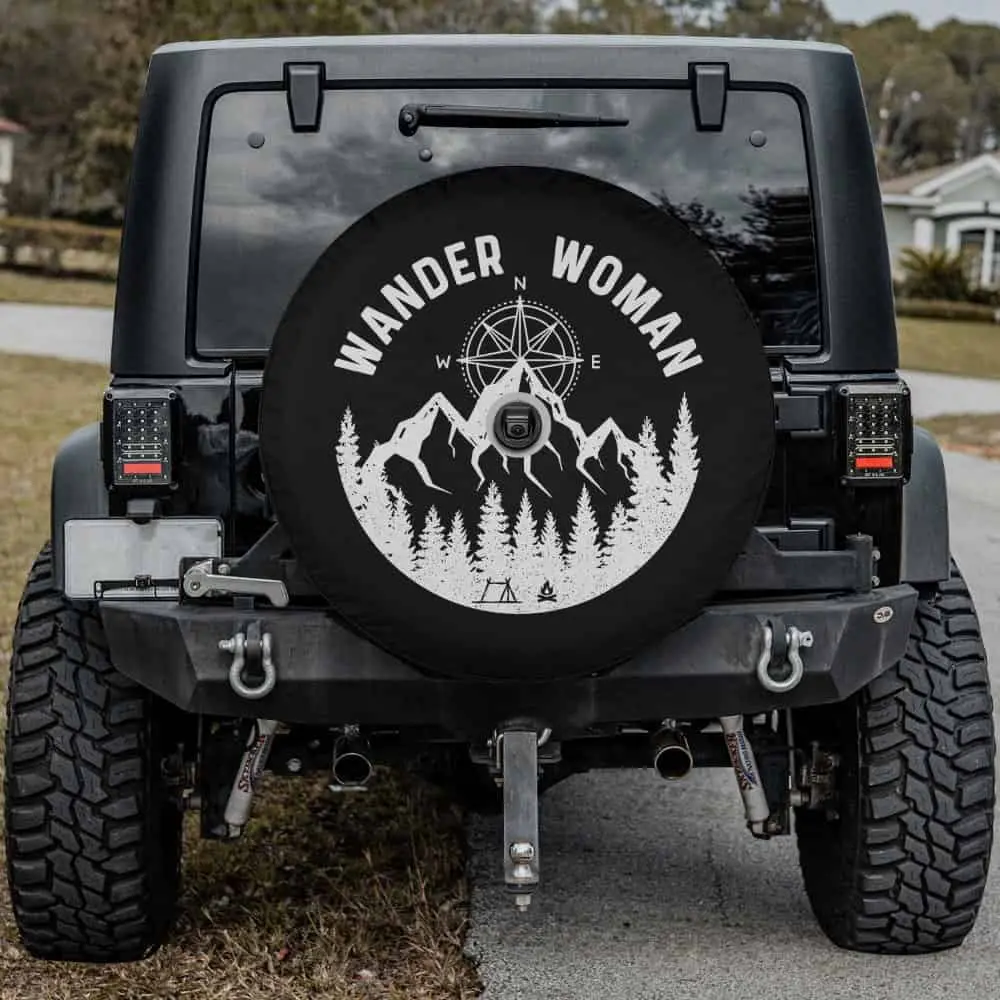 Wander Woman spare tire cover with compass, mountain, pine forest for Mercedes G-Wagon, with camera hole