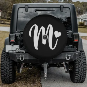 white letter m monogram heart graphic spare tire cover on Mercedes G-Wagon with camera hole