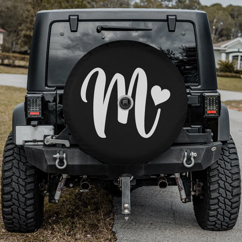 white letter m monogram heart graphic spare tire cover on Mercedes G-Wagon with camera hole